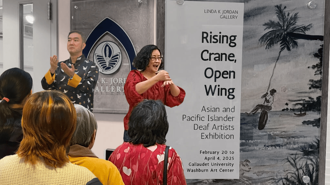 A composite image, with cutout photos of Paul Guo and Kaori Takeuchi signing to a crowd on the left side of the image. In the background is a wall, with a door and sign: "Rising Crane, Open Wing / Asian and Pacific Islander Deaf Artists Exhibition".