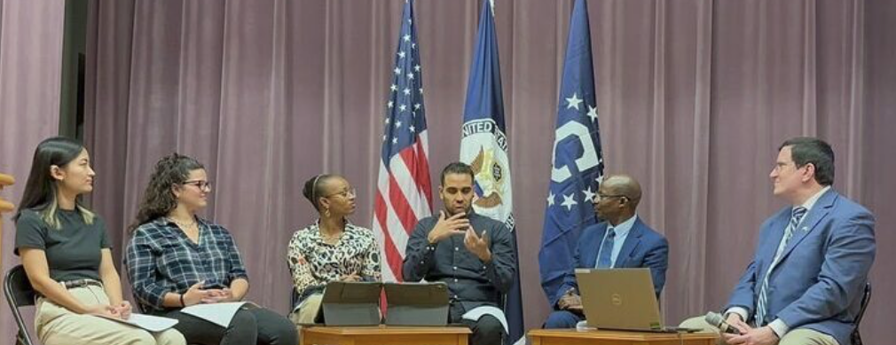 Students and staff participate in a panel with the State Department representatives.